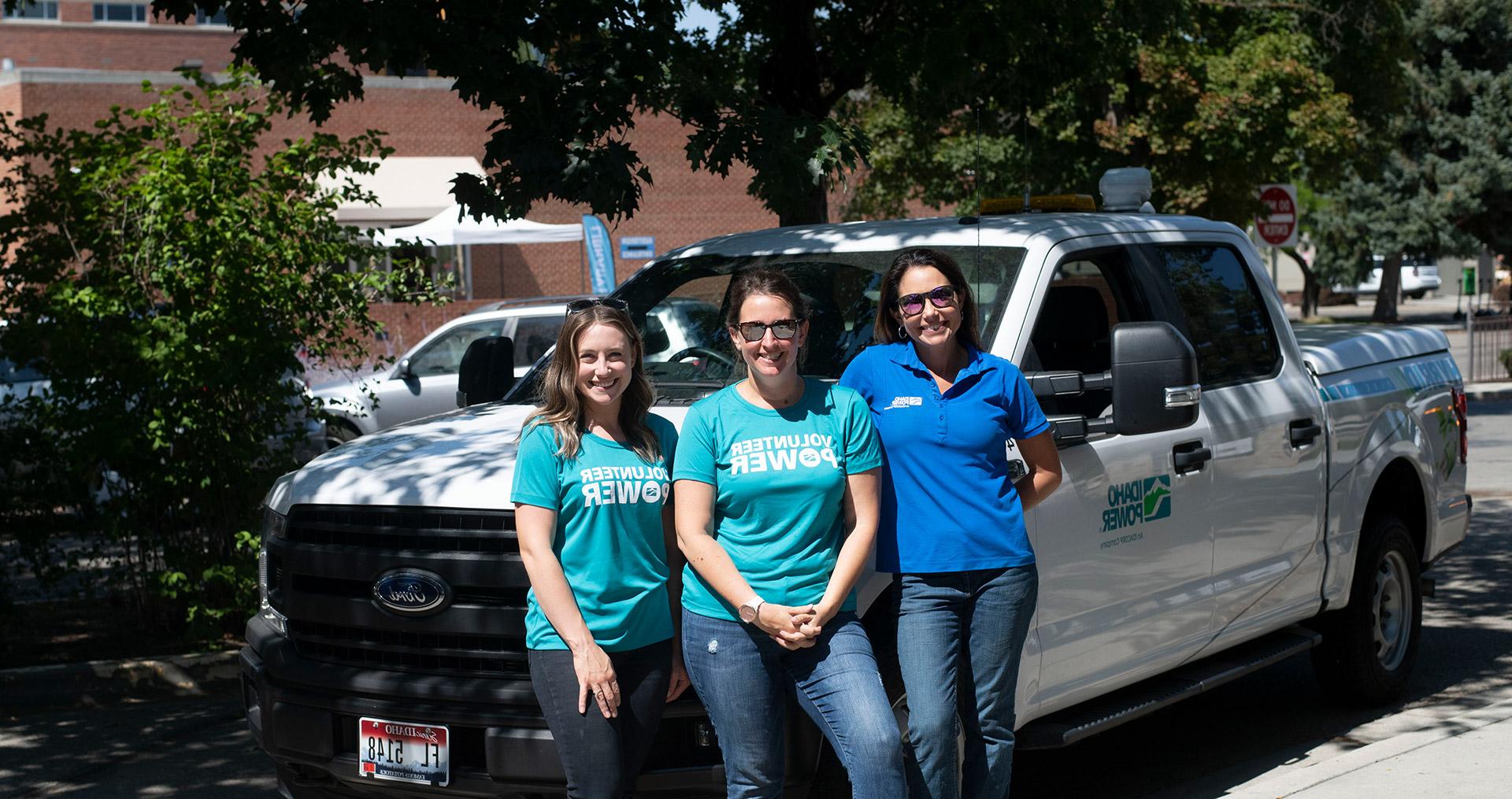 Female employees wearing Volunteer Power shirts